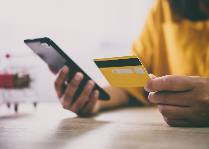 Woman making purchase on her mobile phone